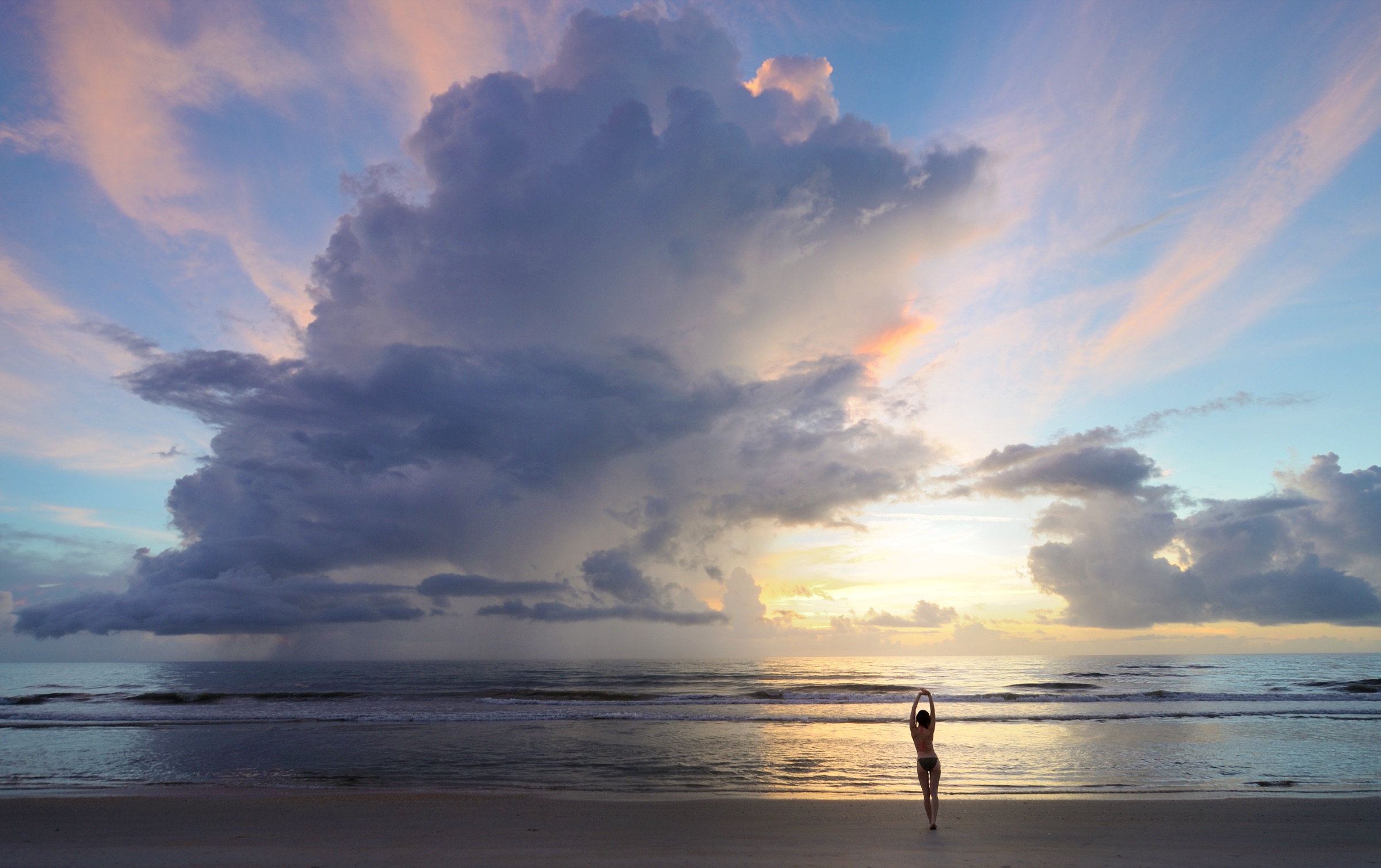 Undeveloped Atlantic beach shoreline at Canaveral National Seashore, Florida, with expansive sky and waves