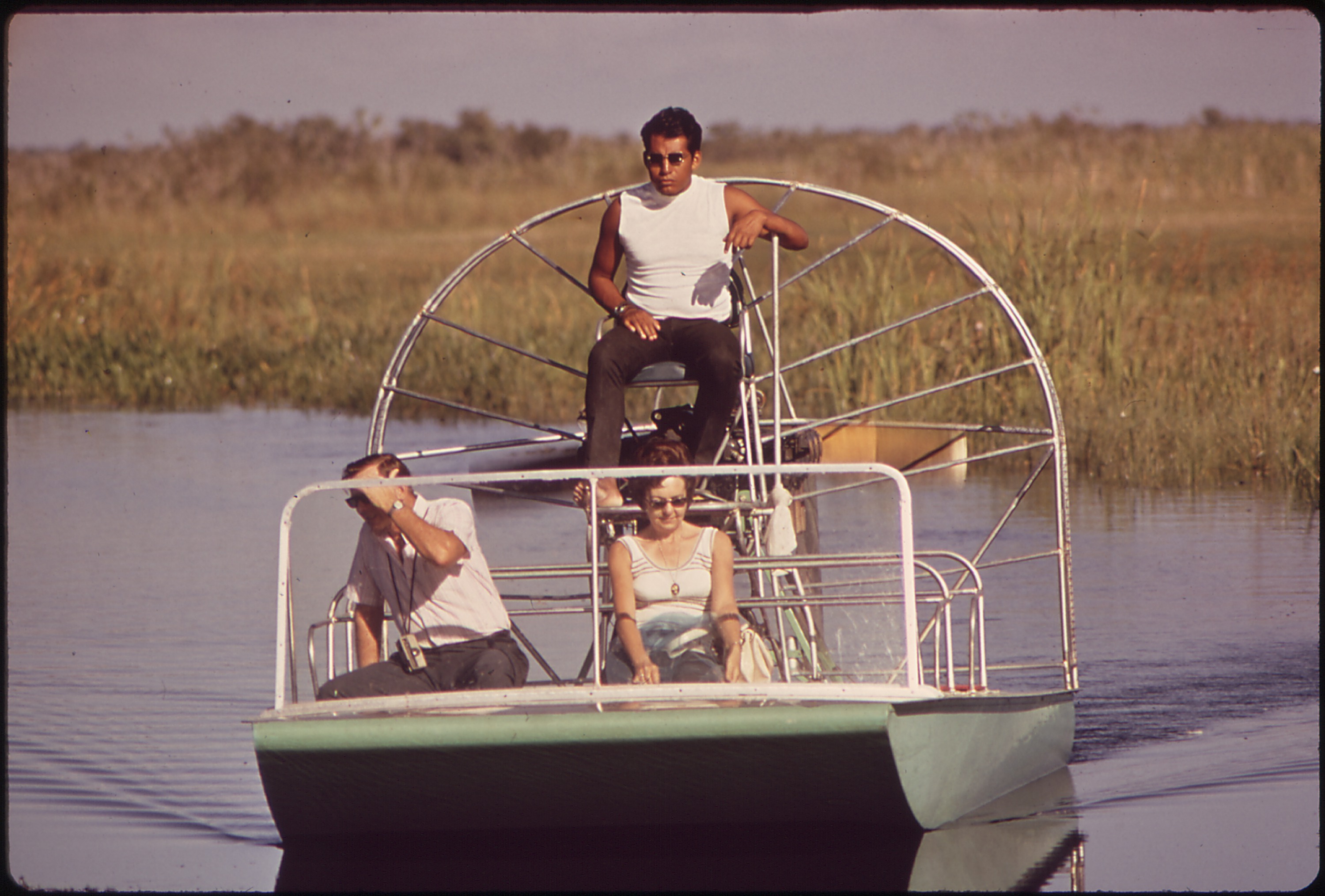 Airboat carrying tourists across the sawgrass along the Tamiami Trail in the Everglades