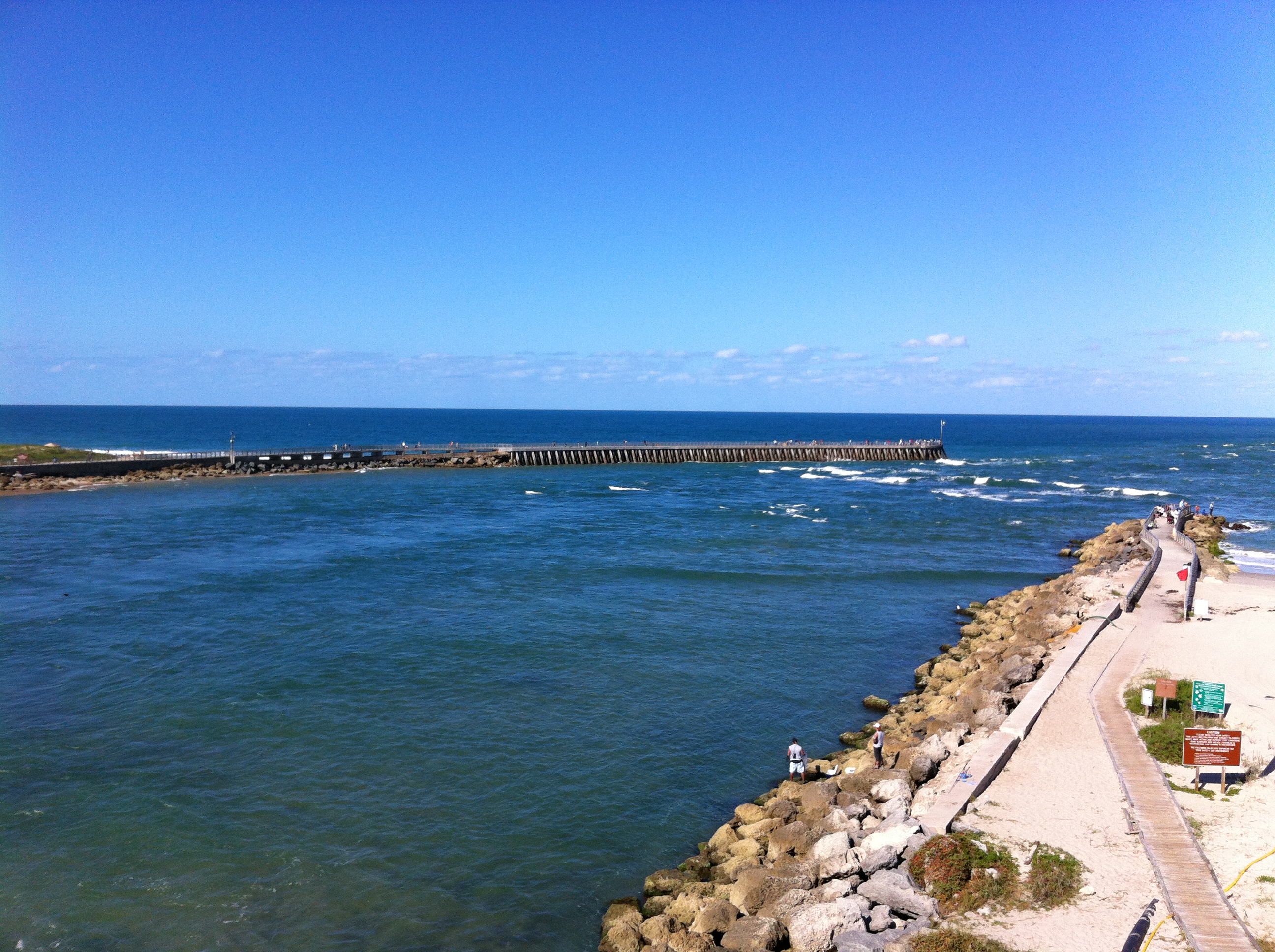 Sebastian Inlet from the A1A bridge — North Jetty on the left, South Jetty on the right, channel running between them