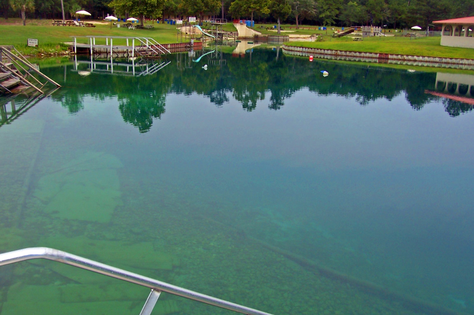 Crystal-clear water of Vortex Spring with the cavern opening visible below the surface